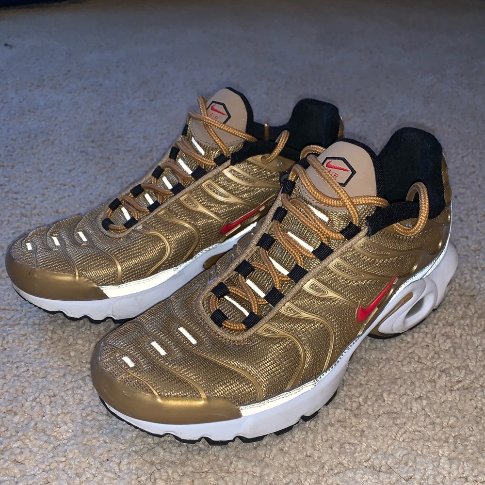 Gold and red air max plus